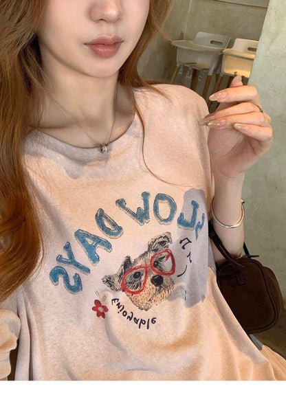 Woman wearing a purple cute dog graffiti t-shirt