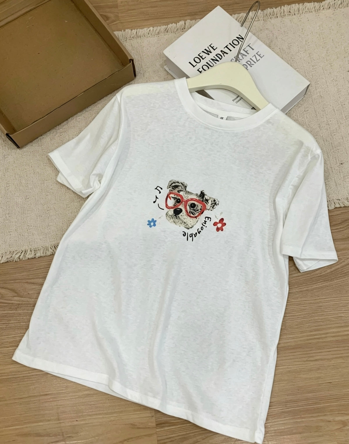 Flat lay of a white dog graffiti t-shirt