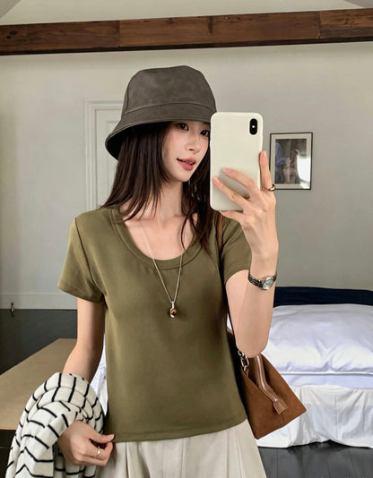 Model wearing an olive green U-neck short-sleeve t-shirt