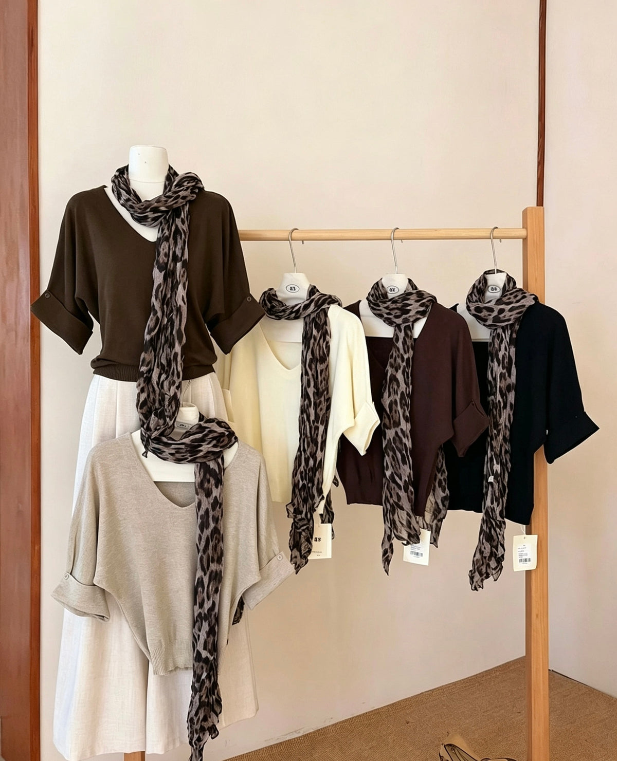Display of multiple color variants of V-neck knit top