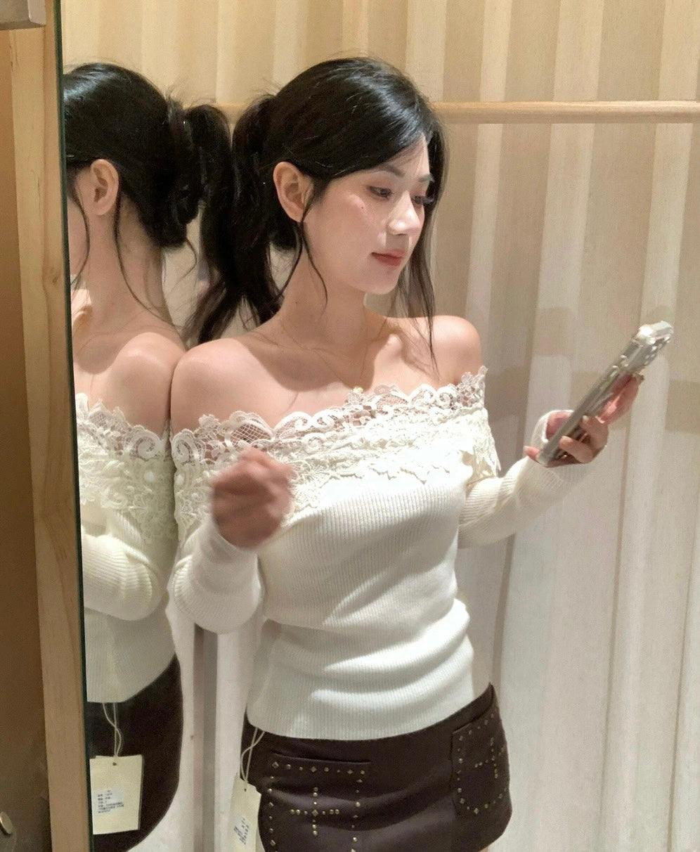 Mirror selfie of woman in white off-shoulder lace top