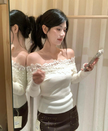 Mirror selfie of woman in white off-shoulder lace top