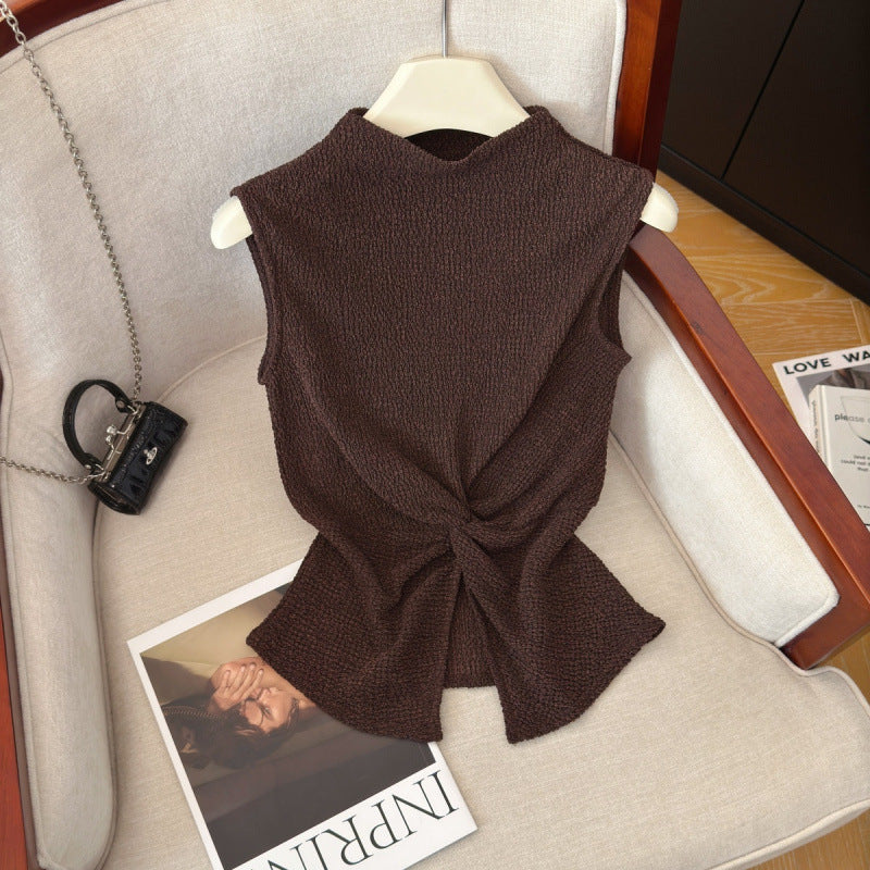 Front view of dark coffee brown mock neck sleeveless top with twist knot