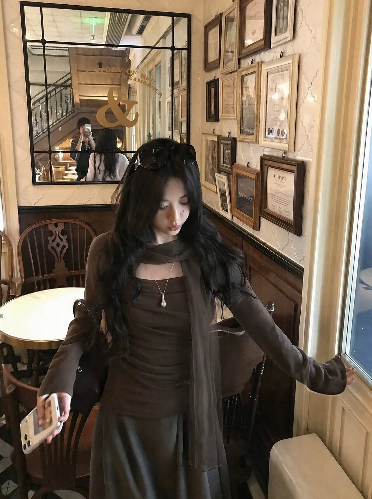 Woman in brown top at cafe