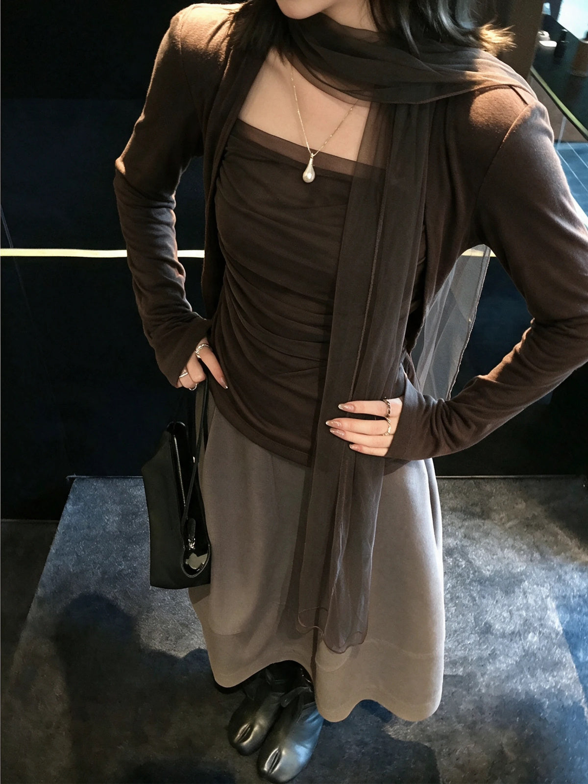 Model wearing brown mesh scarf top