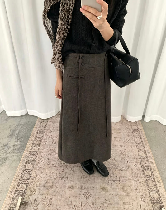 Model wearing a dark grey Korean retro draped high-waisted A-line skirt taking a mirror selfie