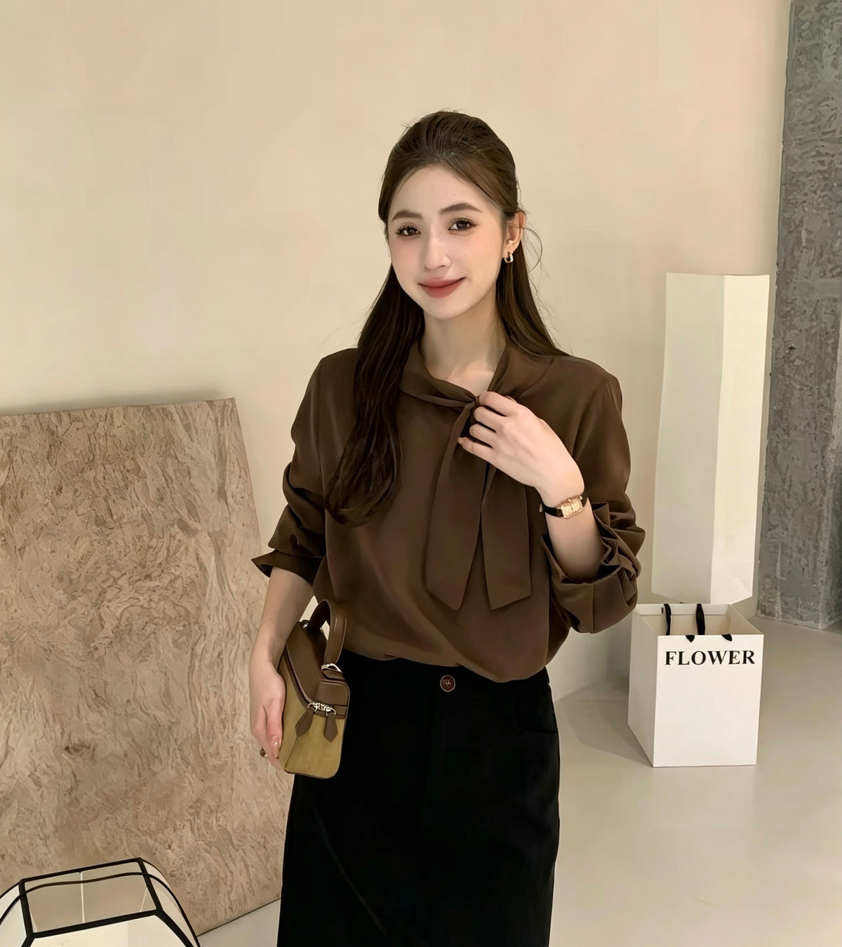 Model wearing dark brown tie-neck long-sleeve shirt